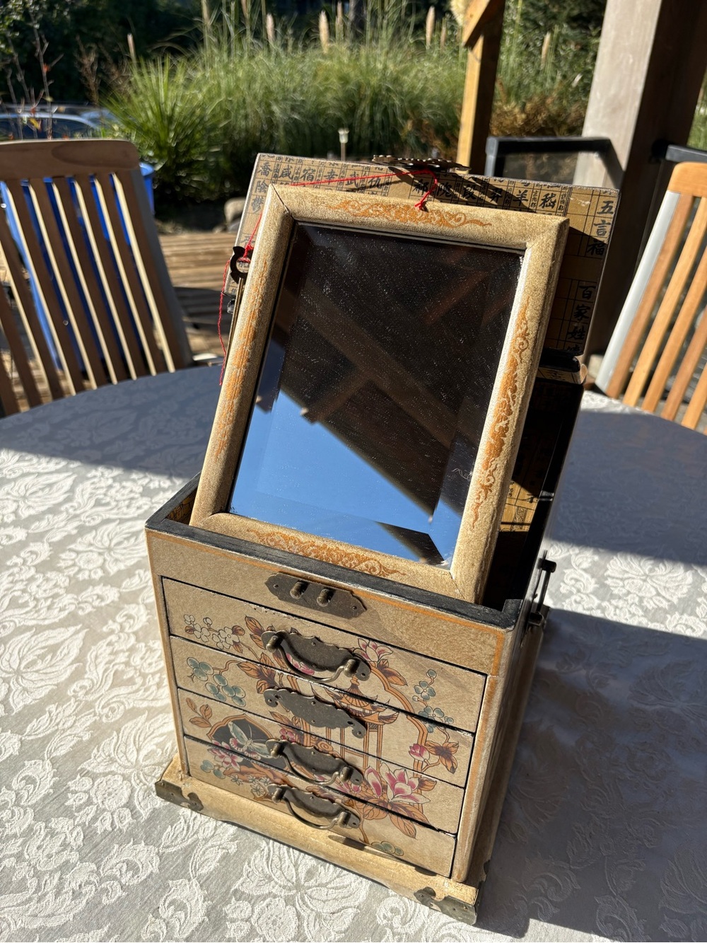 Vintage Chinese four drawer travelling jewellery box with mirror